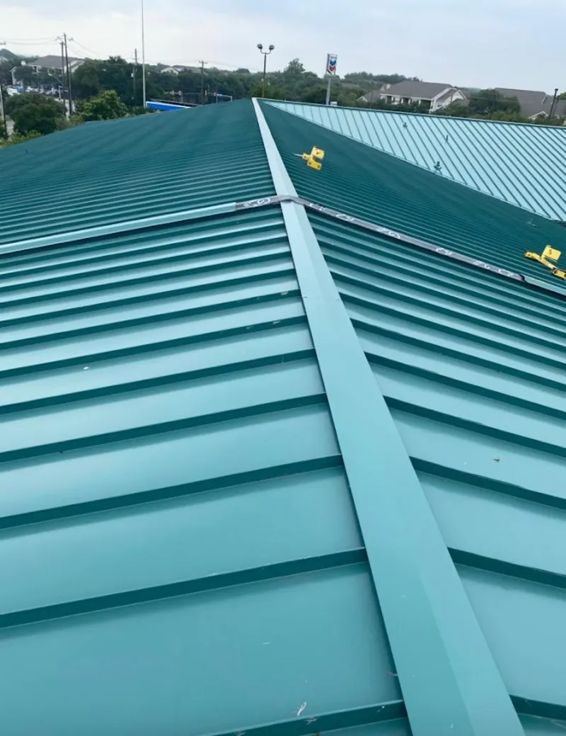 Green commercial metal roof ridge and valley for Metal Roof Repair in Whiskey Creek